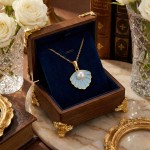 Smykke i forgylt sølv med lys blå coloritt og perle - 3042542