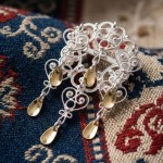 Barnesølje i hvit  og forgylt sølv