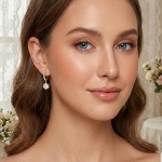 Kreoler i forgylt sølv med cirkonia og hvit prestekrage. LIV - 701303